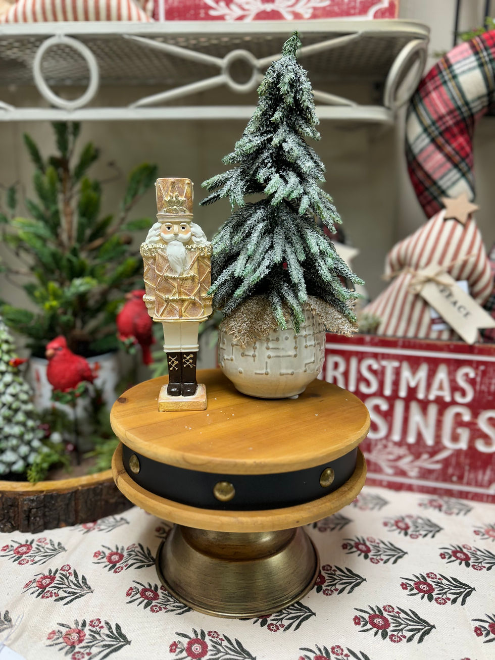 8" tall x 2.25" wide resin nutcracker in brown, cream & white tones