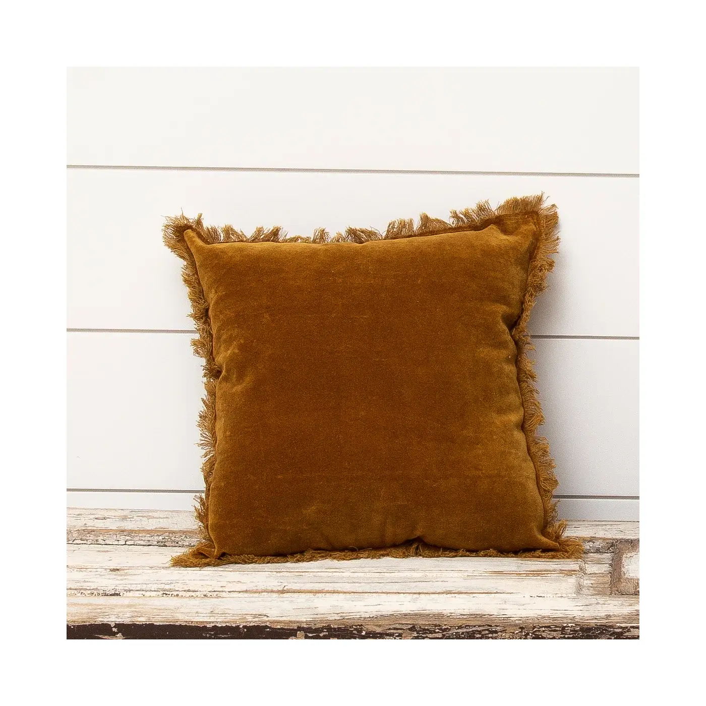 Velvet Pillow with eyelash fringe edges in a rust color