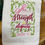 Thumbnail: white cotton tea towel embroidered with verse "she is clothed with strength  & dignity" Proverbs 31:25