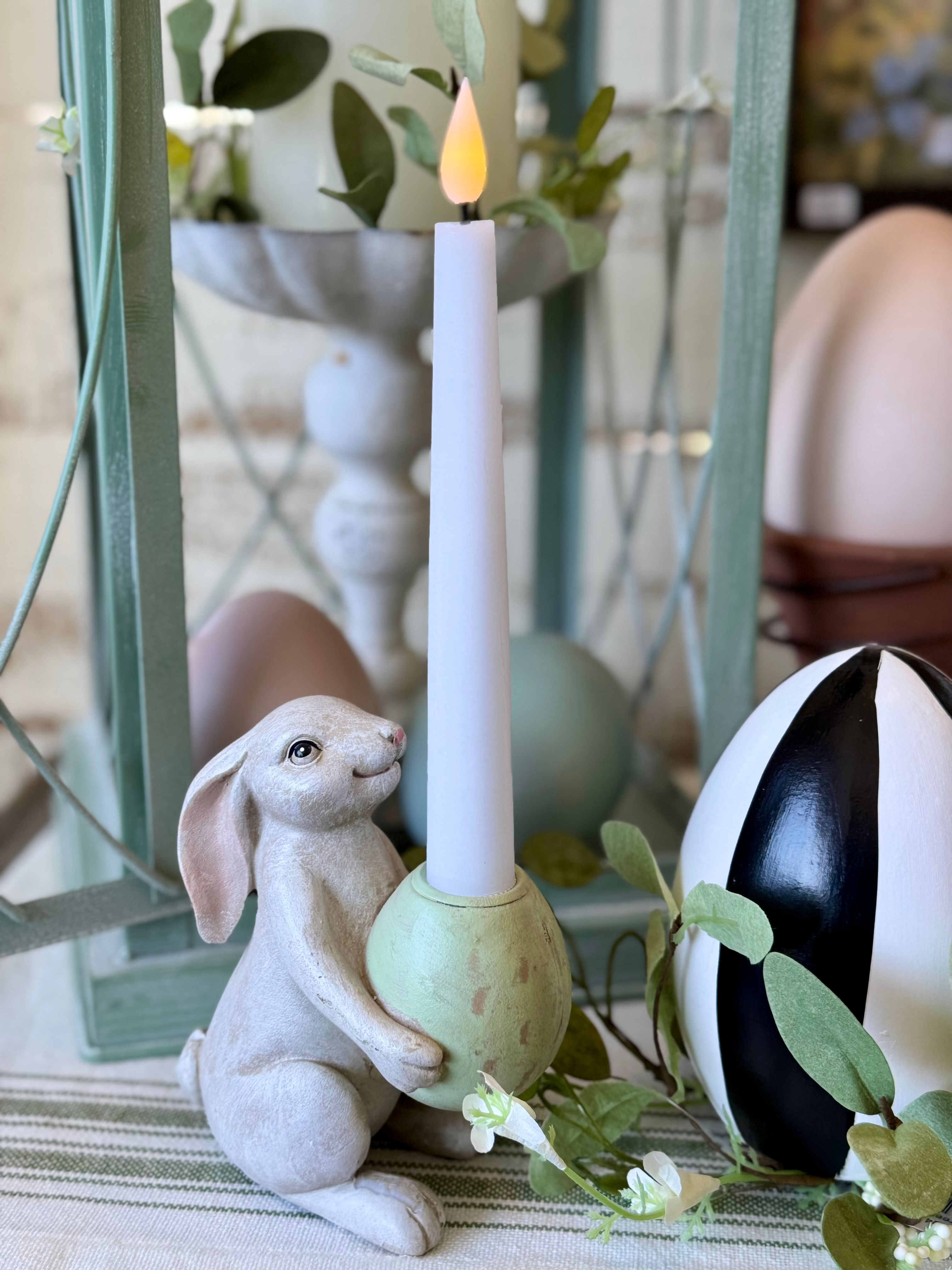 5.5" resin white rabbit holding green egg, antique finish, egg is a taper candle holder