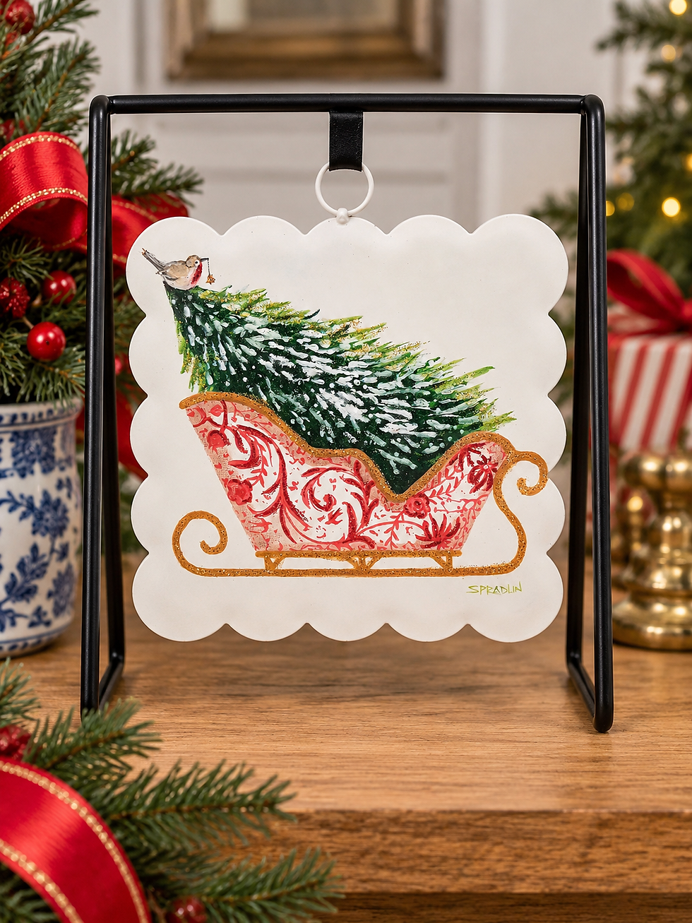 Thumbnail: Round Top Collection scalloped metal Christmas art featuring a red and white chinoiserie sleigh with gold accents, a snow-cov