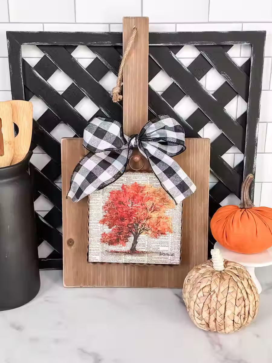 6" x 1" x 7" Round Top Collection print of a book page painted with a fall tree, corrugated metal frame, ring on top to hang
