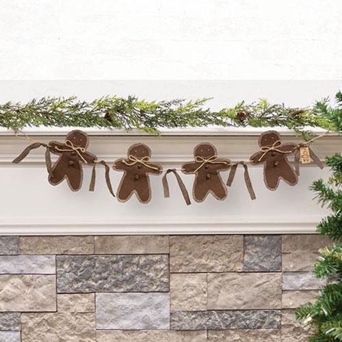 Fabric gingerbread man cookies strung on a jute string to make a garland