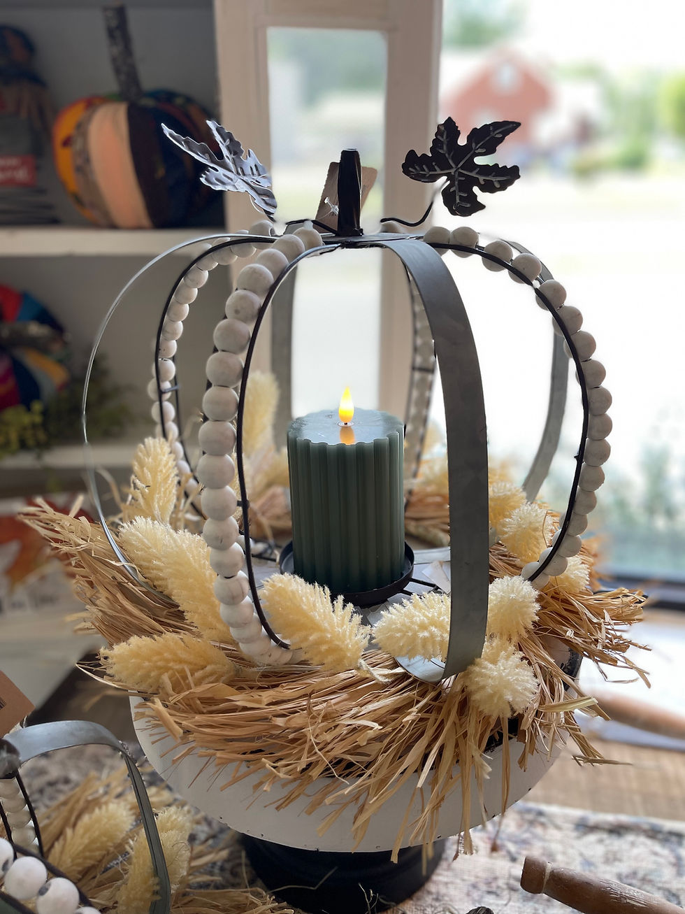 12.5"x12" Pumpkin form, alternating metal bands with white wood bead bands, pillar candle holder inside,metal stem & 2 leaves