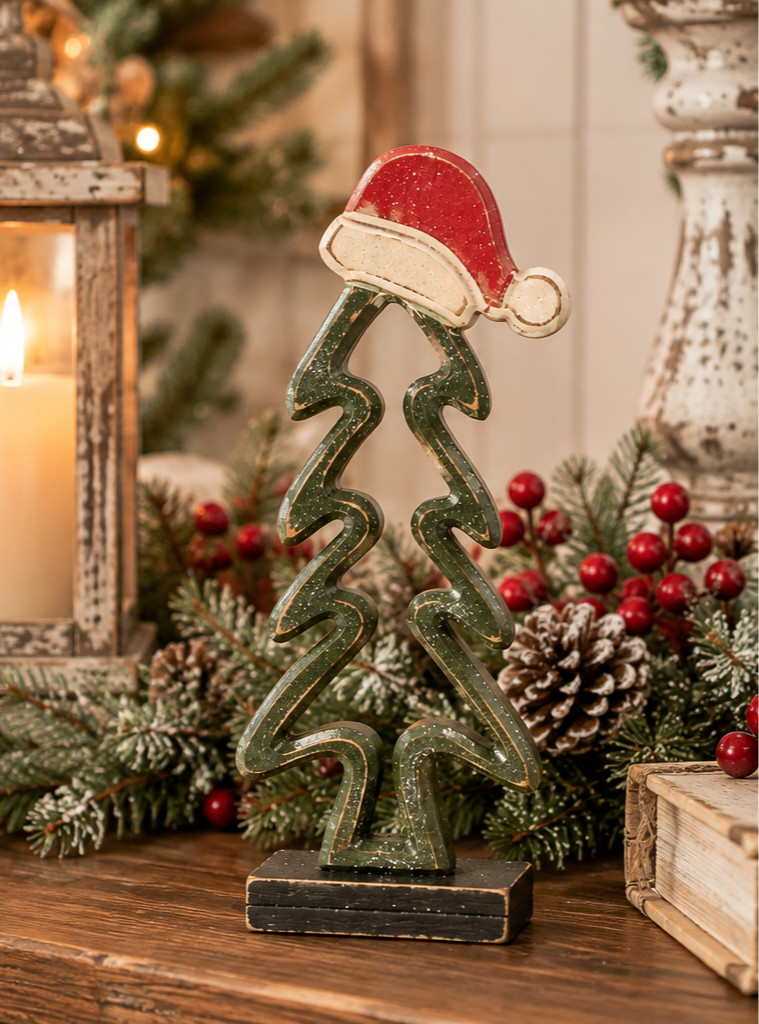 12.5 inch wood Christmas tree with deep green open design, glitter accents and red Santa hat.