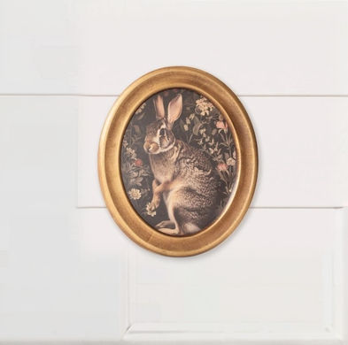 12" H x 10" W print of a rabbit in William Morris style, framed in gold finish oval wood frame with glass