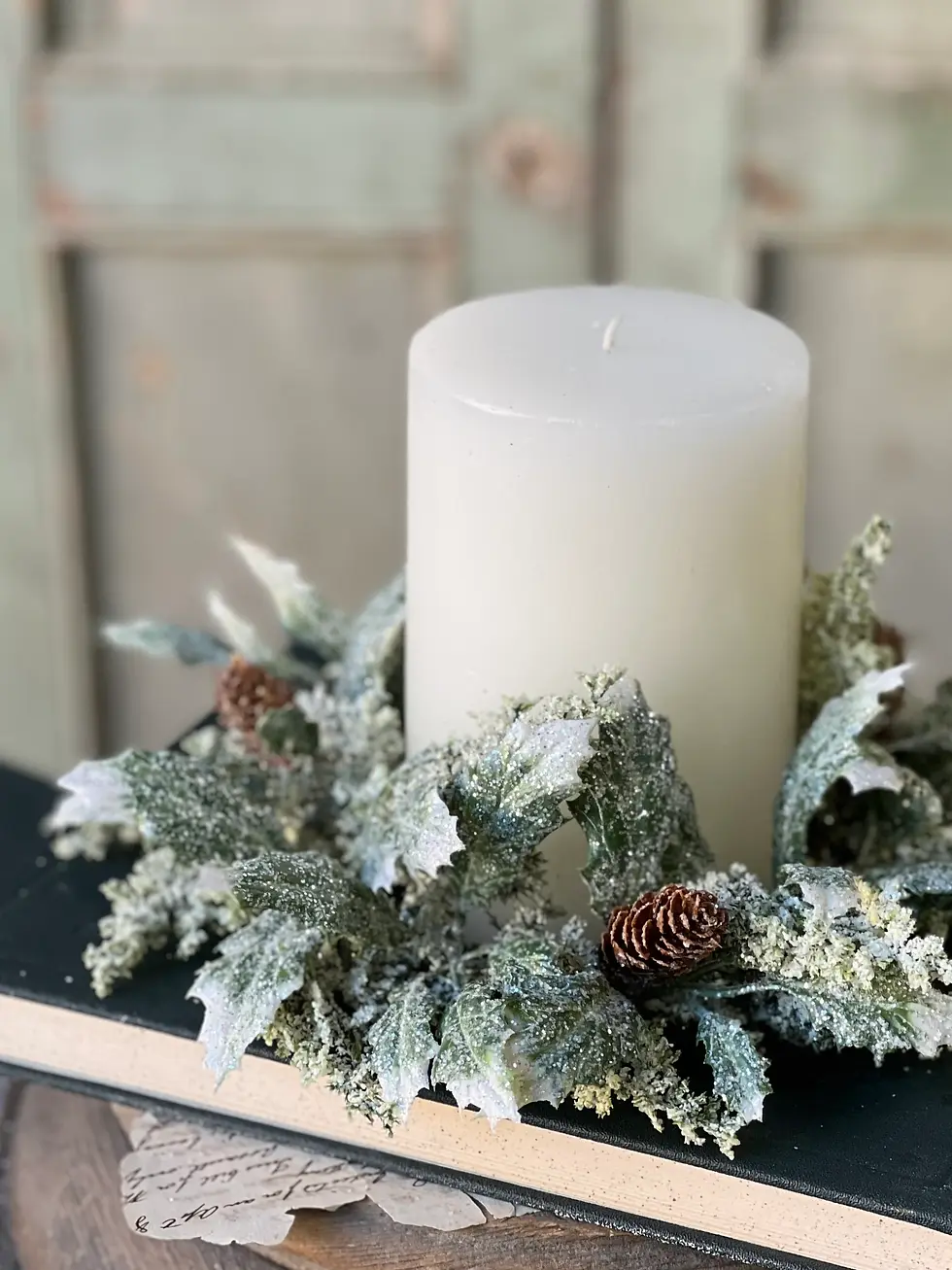 10" candle ring with 4" inner opening,  variegated holly greenery is dusted with glitter, spires and pinecones