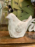 White resin bird has the appearance of carved wood. 4"x5.5"x1.5"