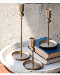 set of 3 iron candle sticks painted dull gold, tallest holder is 12"
