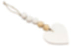 Wood beads strung on jute with a flat white wooden heart on the end. 3" x 8"