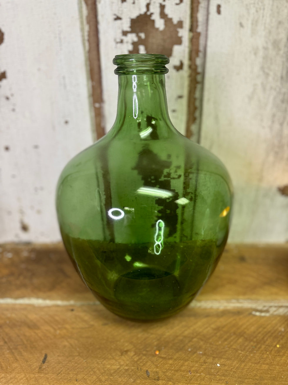 13" tall x 8" diameter green glass bottle with narrow neck