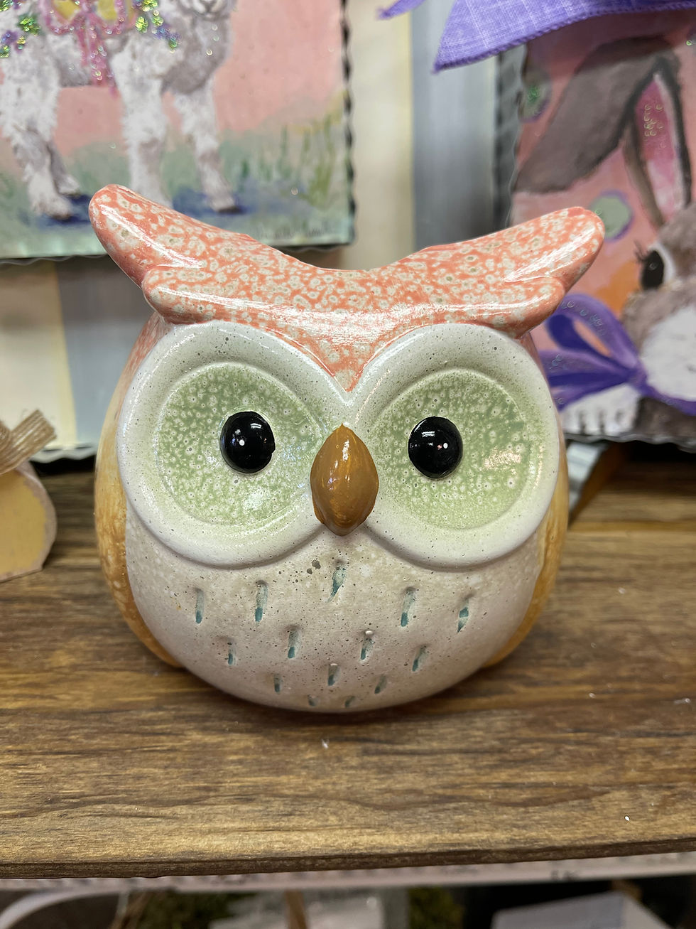 Porcelain owl flower pot with a glazed finish. Watery pinks and yellows accented with green. 5.3"x4.9"x5.1"