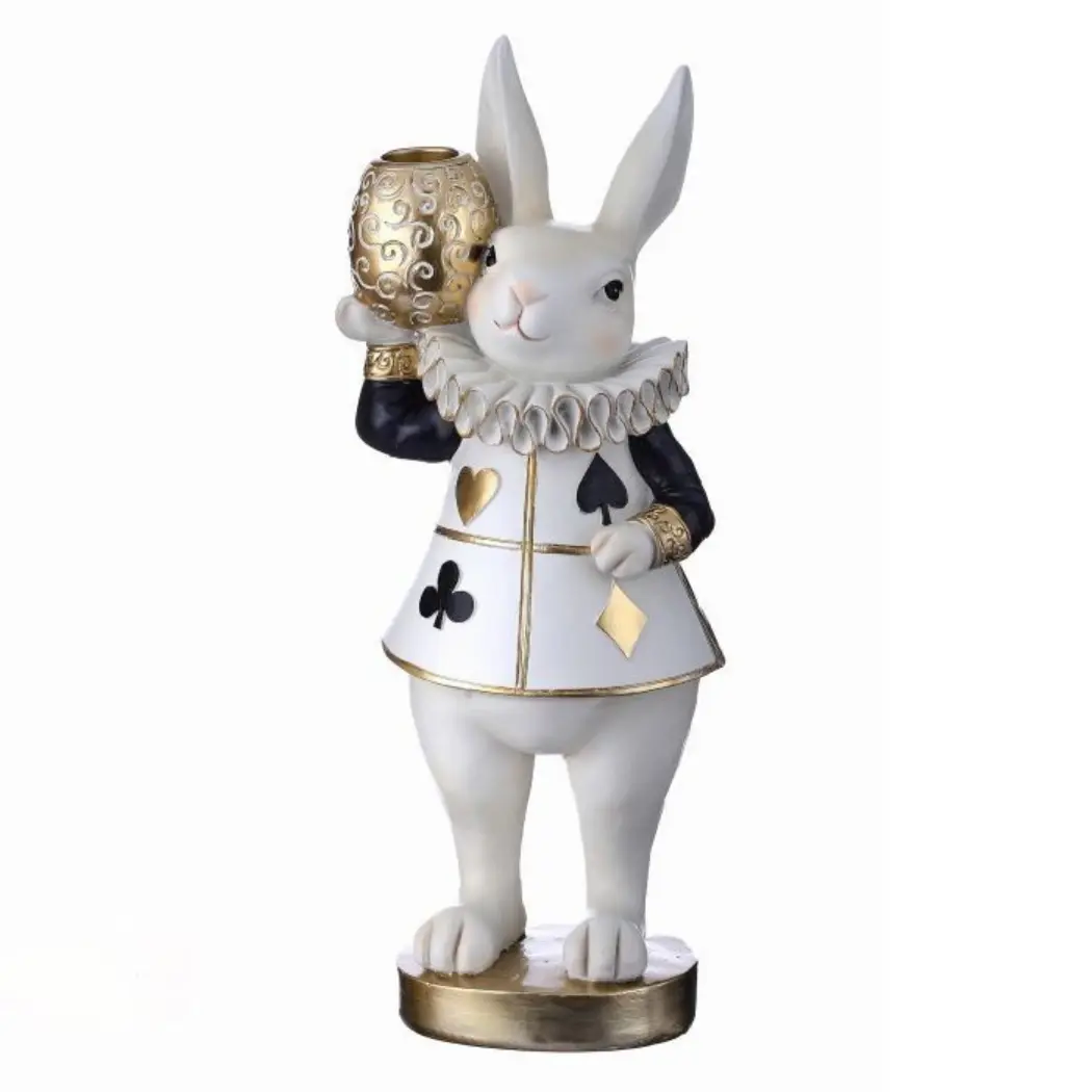 11" tall resin taper holder, white standing bunny, royal shirt in black, white & gold card suit symbols, holding gold egg