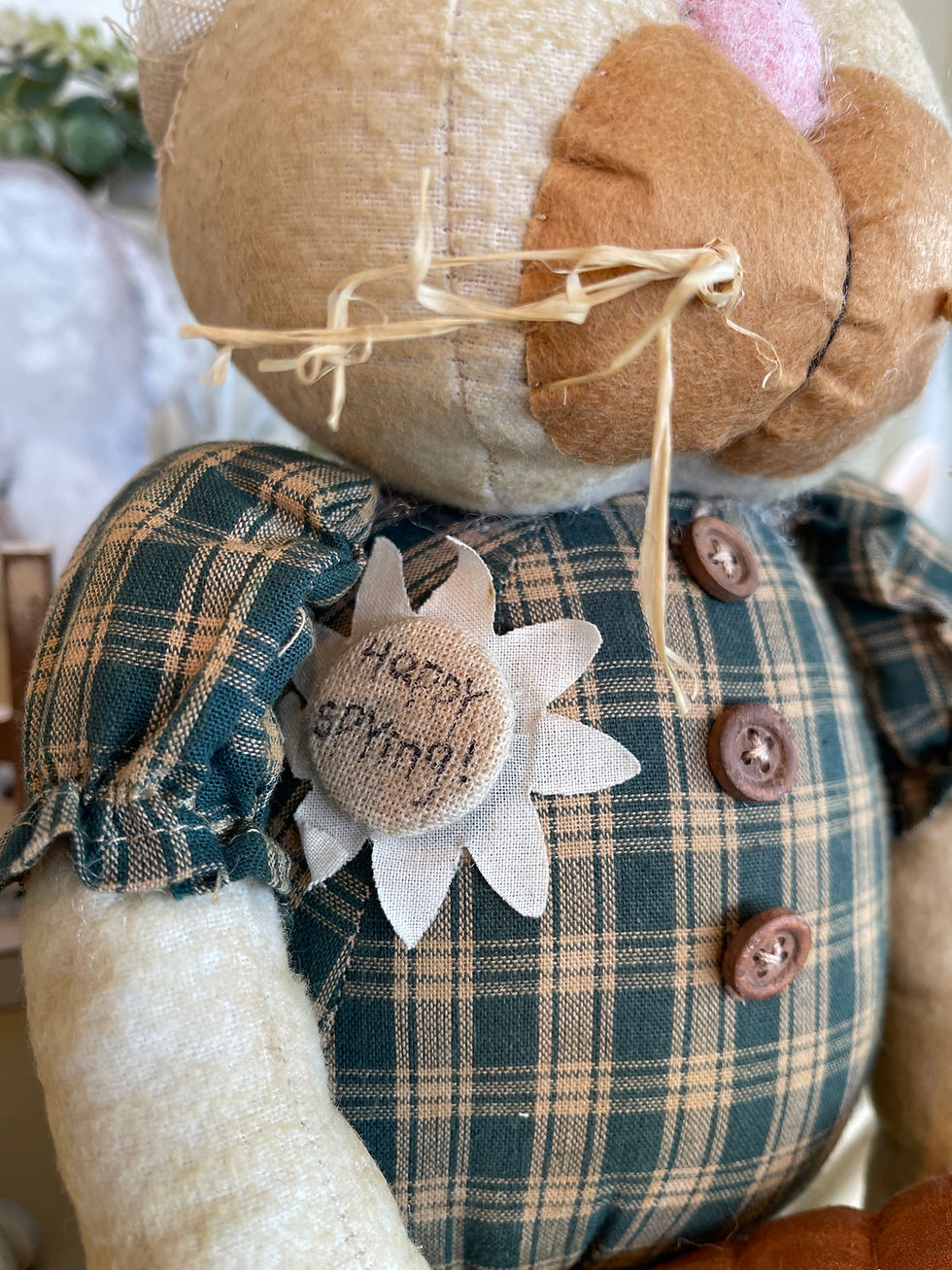 Stuffed cream fabric bunny from the waist up. Green plaid shirt with wood buttons felt white daisy on shirt 15" 7"x6"