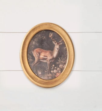 12" H x 10" W print of a deer in William Morris style, framed in a gold finish wood oval frame with glass