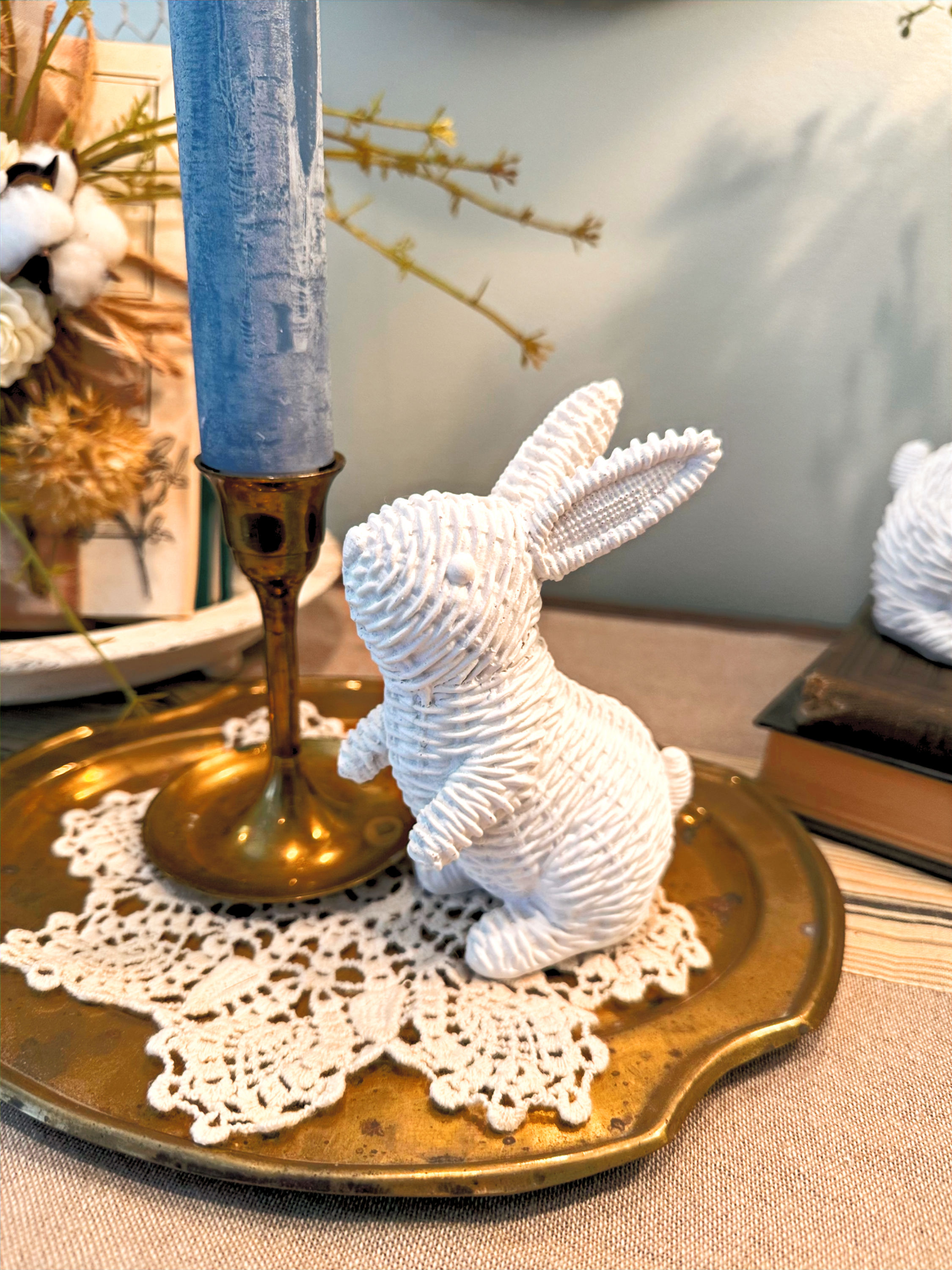5" tall white resin bunny standing on hind legs, looks like wicker