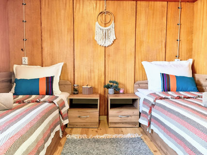 Twin bedroom in a bungalow at Brusen Hill Camping