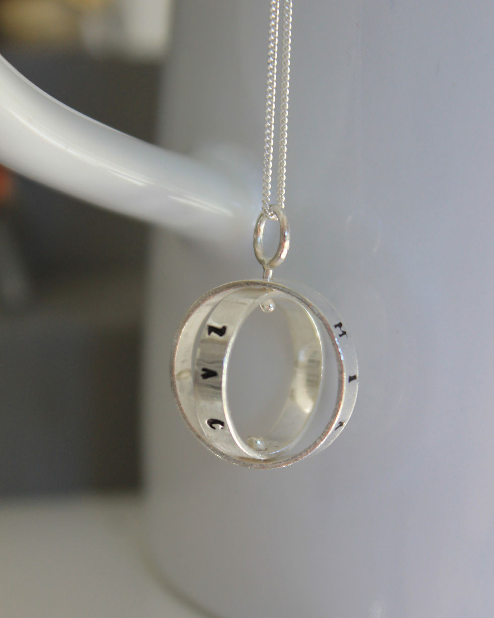 Thumbnail: Silver Spinning Names Pendant