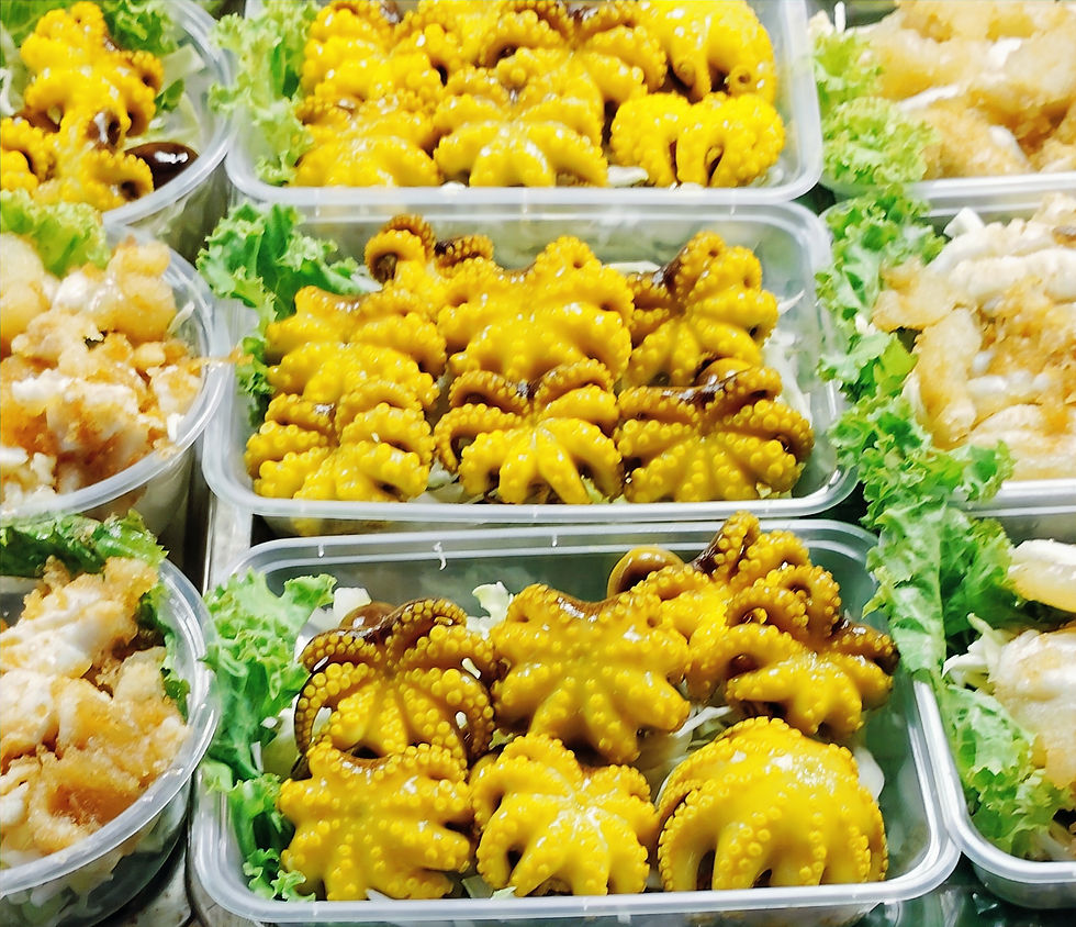 Baby octopus cooked and ready to eat at a night market in Thailand