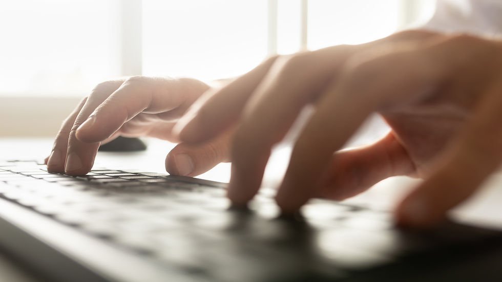 hands typing on a keyboard