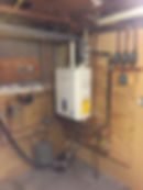 Navien tankless water heater and copper piping installation by Quality Home Services.