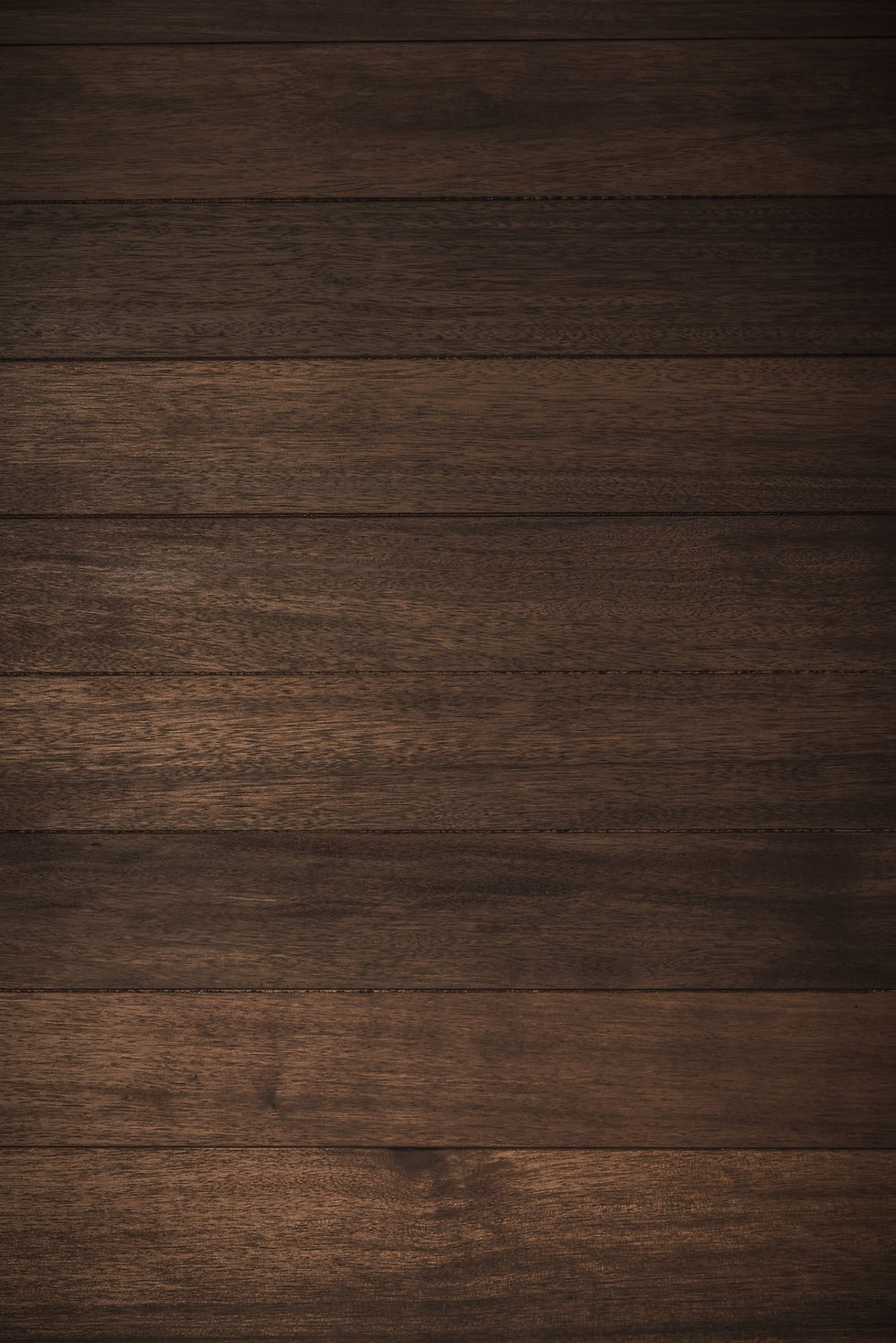 Textured dark brown wooden plank background, ideal for website design or as a rustic backdrop for equine business themes.