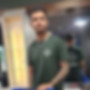 Professional barber standing next to a barber chair at House of Barbers HV, ready for the next client. Modern barbershop int