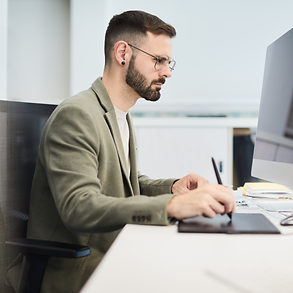 man working on office computer