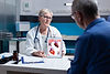 physician-explaining-cardiology-diagnosis-with-image-heart-organ-tablet-patient-general-pr