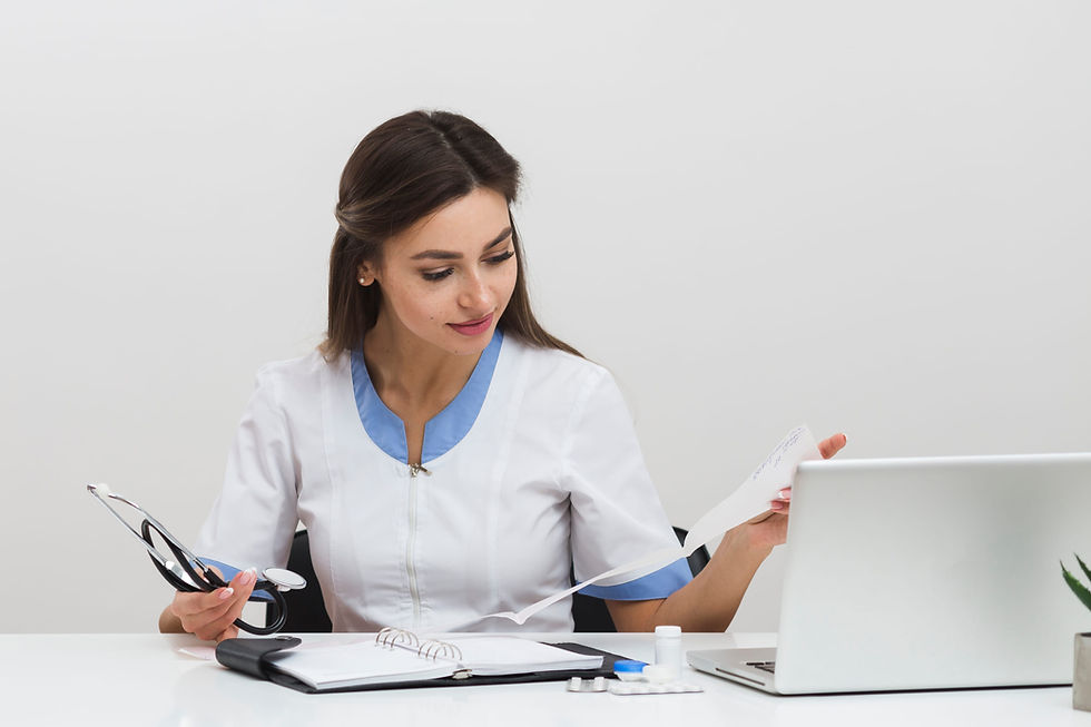 young-female-doctor-looking-n-medical-reports (1).jpg