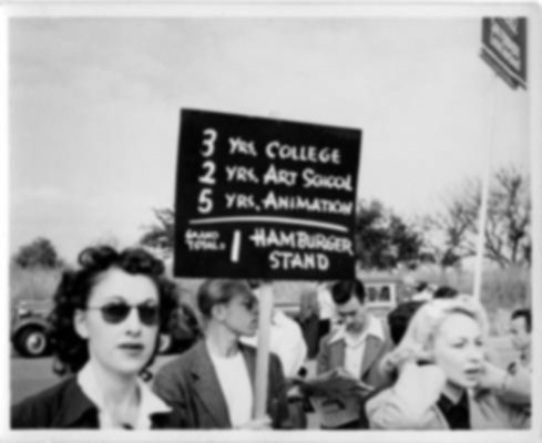 Protester holding a sign at Disney.