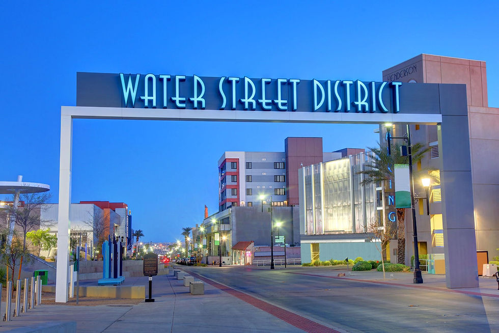 Evening view of Water Street District in Henderson, Nevada featuring local shops, dining, and modern city atmosphere.