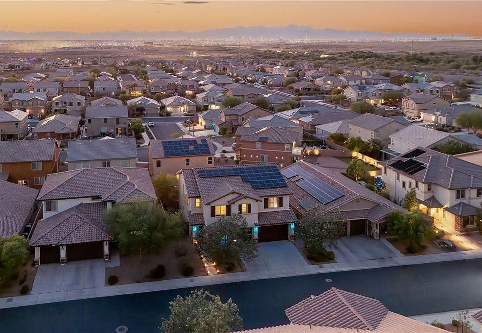 Aerial sunset view of residential homes and neighborhoods in Henderson, Nevada showcasing suburban community living.
