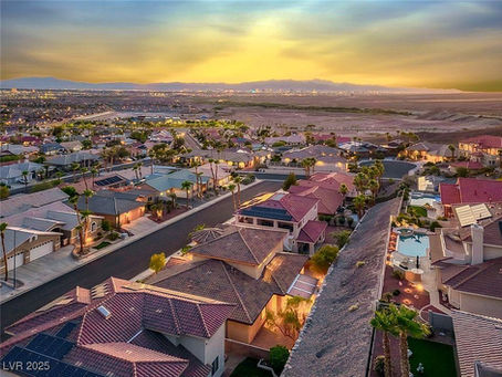 Scenic aerial sunset view of Henderson, Nevada neighborhoods highlighting desert living and residential communities.