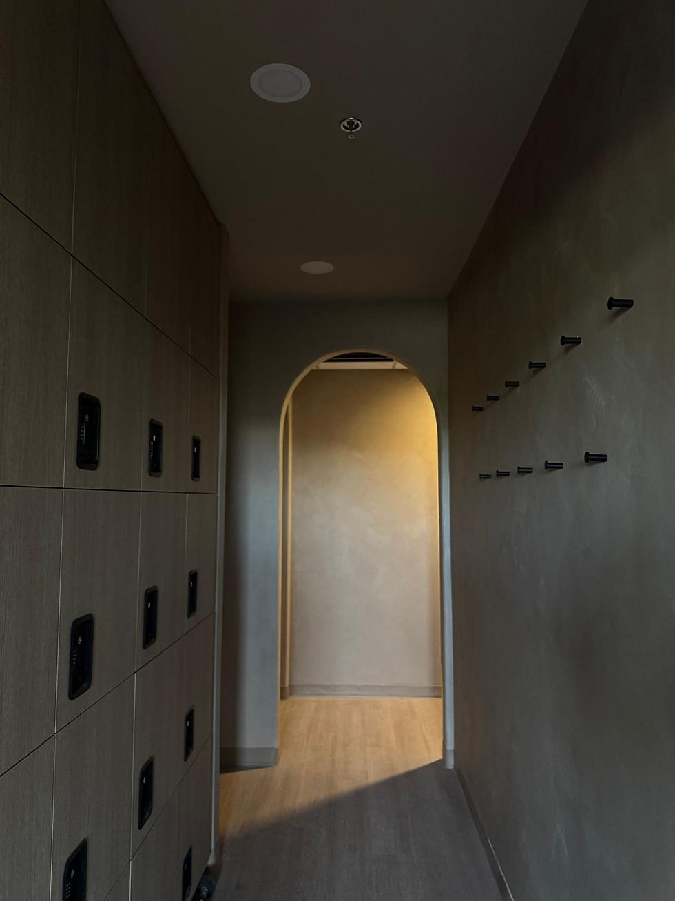 Entrance hallway with lockers and arched doorway at Afitness Pilates in St. Albert