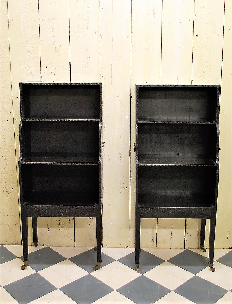 Thumbnail: Pair of Regency style Ebonised Waterfall Bookcases/shelves
