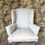 Thumbnail: Antique upholstered wing chair