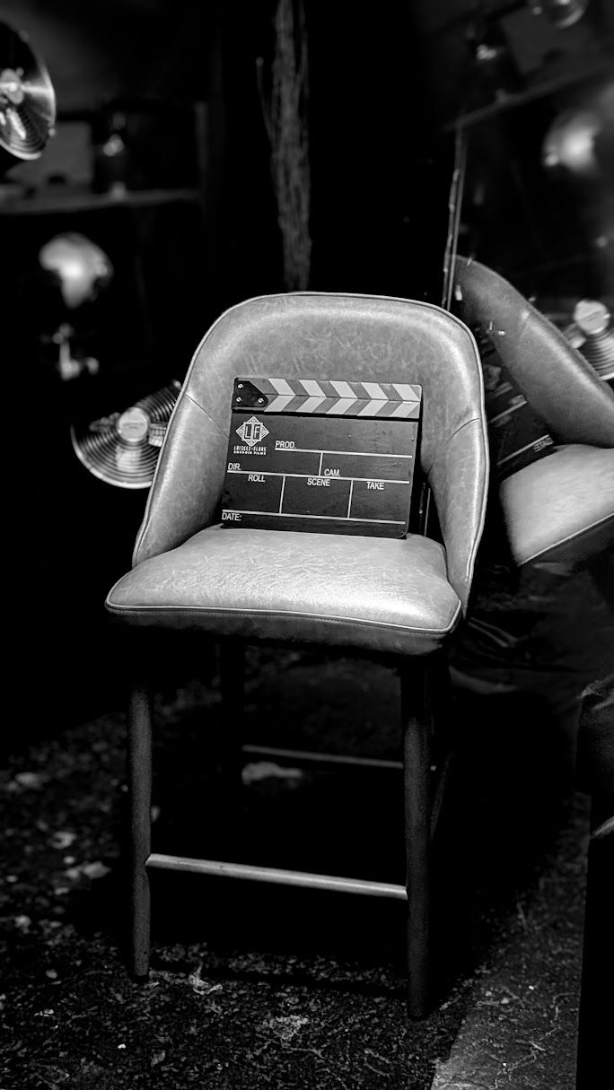 A custom film slate sits on a leather stool at the debut of The Vault by Laissez-Flare at the Liberation Through Leather event in Atlanta.