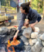 jacqui cooking over campfire
