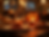A-festive-halloween-themed-table-setting-with-glowing-pumpkins-and-italian-dishes-in-a-war
