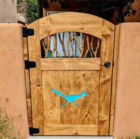 Custom wooden gate with natural stain and turquoise roadrunner design by Narrow Leaf Woodworks in Albuquerque