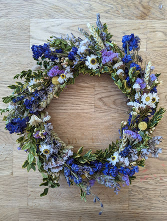 Handmade dried flower wreath in lilac, purple and yellow