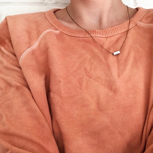 A sweatshirt that I dyed with loquat, over the years after many washing the color faded and a I re-dyed the piece