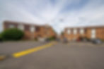 Bozeman apartments with brick buildings and a parking lot