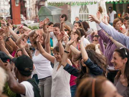 A group of people dancing and celebrating