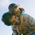 Father Carrying Child Outdoors