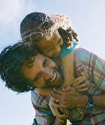 Father Carrying Child Outdoors