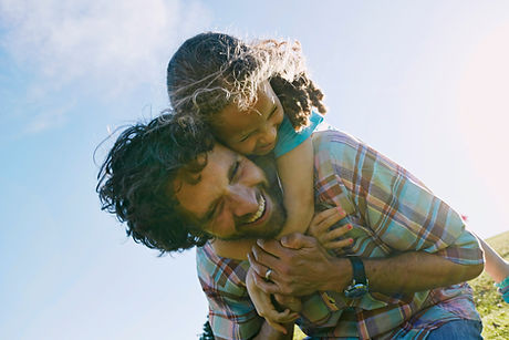 Father Carrying Child Outdoors