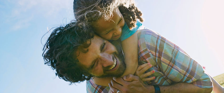 Father Carrying Child Outdoors