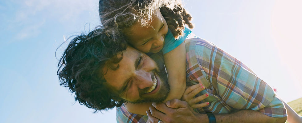 Father Carrying Child Outdoors